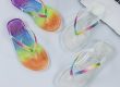 Women's jelly flip flops with colorful rhinestone edging